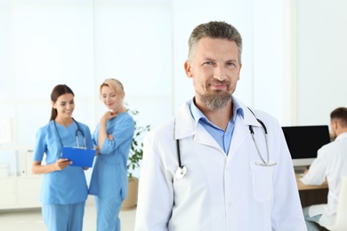 Photo of Doctor and medical assistants in clinic. Health care service