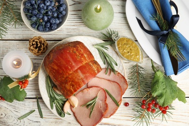 Photo of Flat lay composition with delicious ham on white wooden table. Christmas dinner