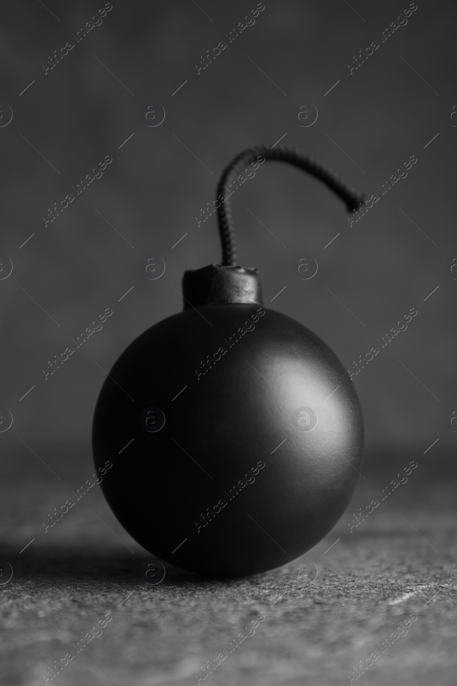 Photo of Old fashioned fuse bomb on grey table