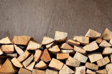 Cut firewood on brown background. Heating in winter