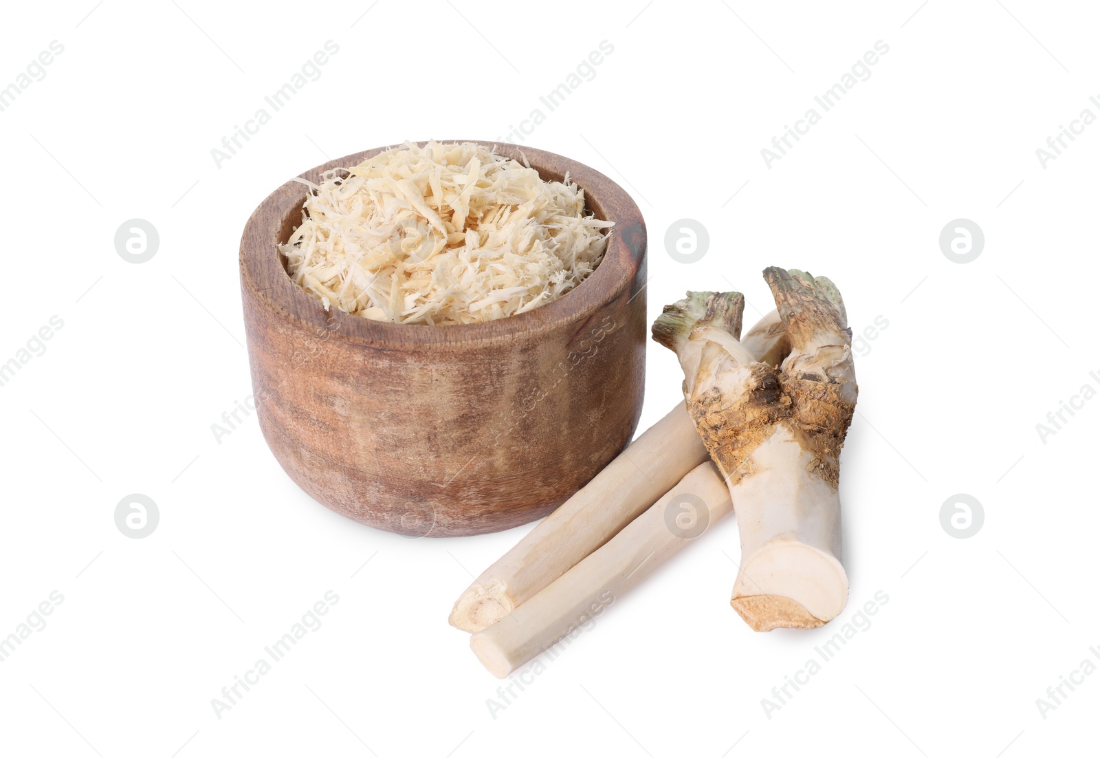 Photo of Grated horseradish in bowl and roots isolated on white