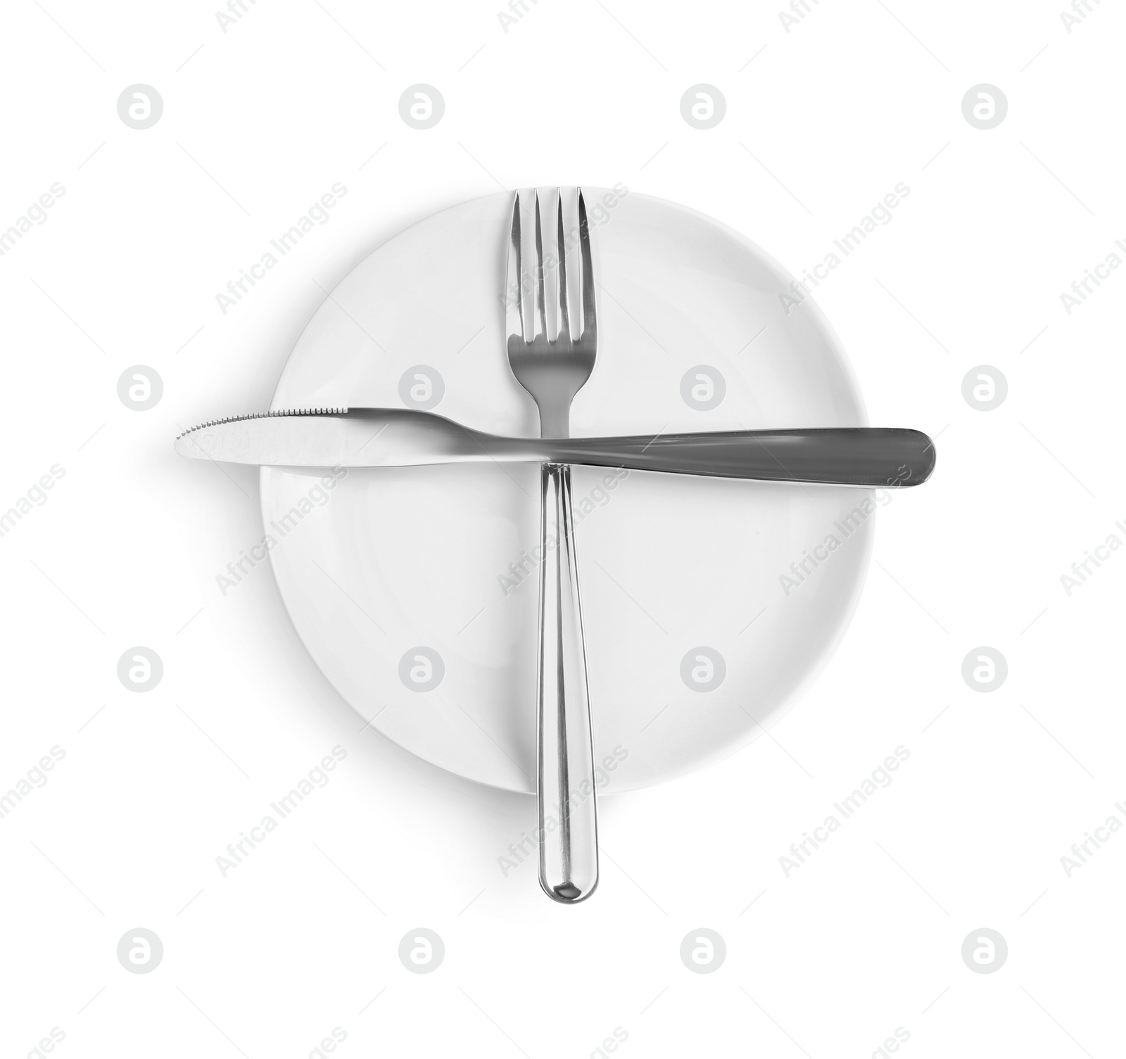 Photo of Ceramic plate, fork and knife on white background, top view