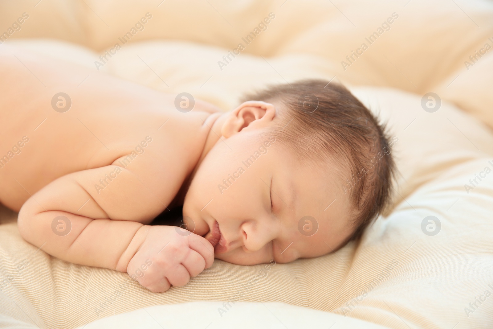 Photo of Adorable newborn baby sleeping on bed