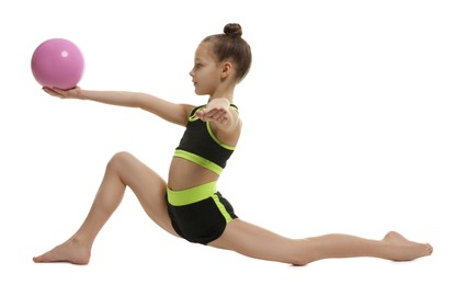 Photo of Cute little girl with ball doing gymnastic exercise on white background