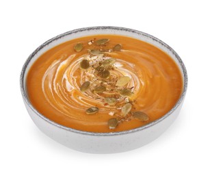 Photo of Tasty pumpkin soup with seeds and cream in bowl isolated on white