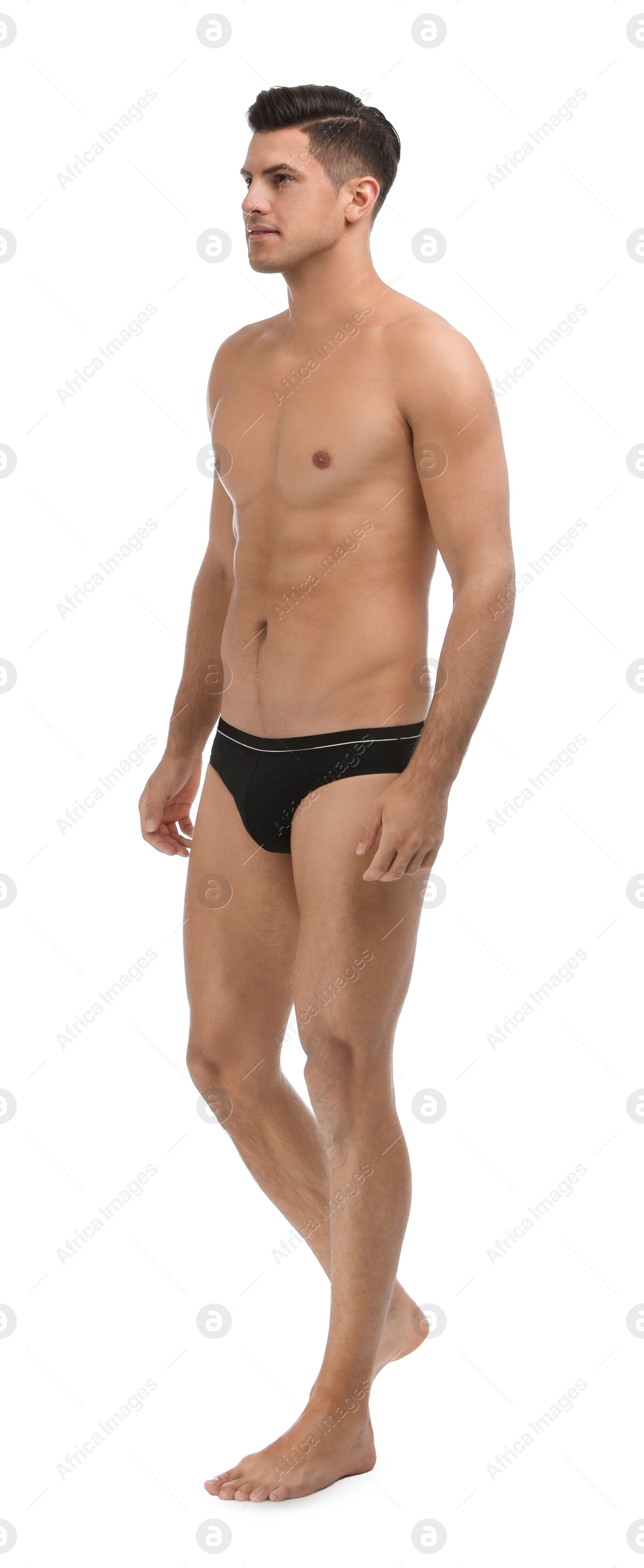 Photo of Handsome man in black underwear on white background