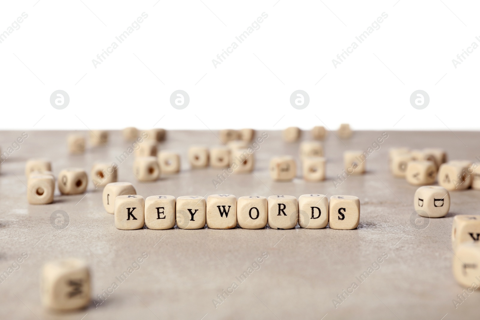 Photo of Beads with word KEYWORDS on light grey table