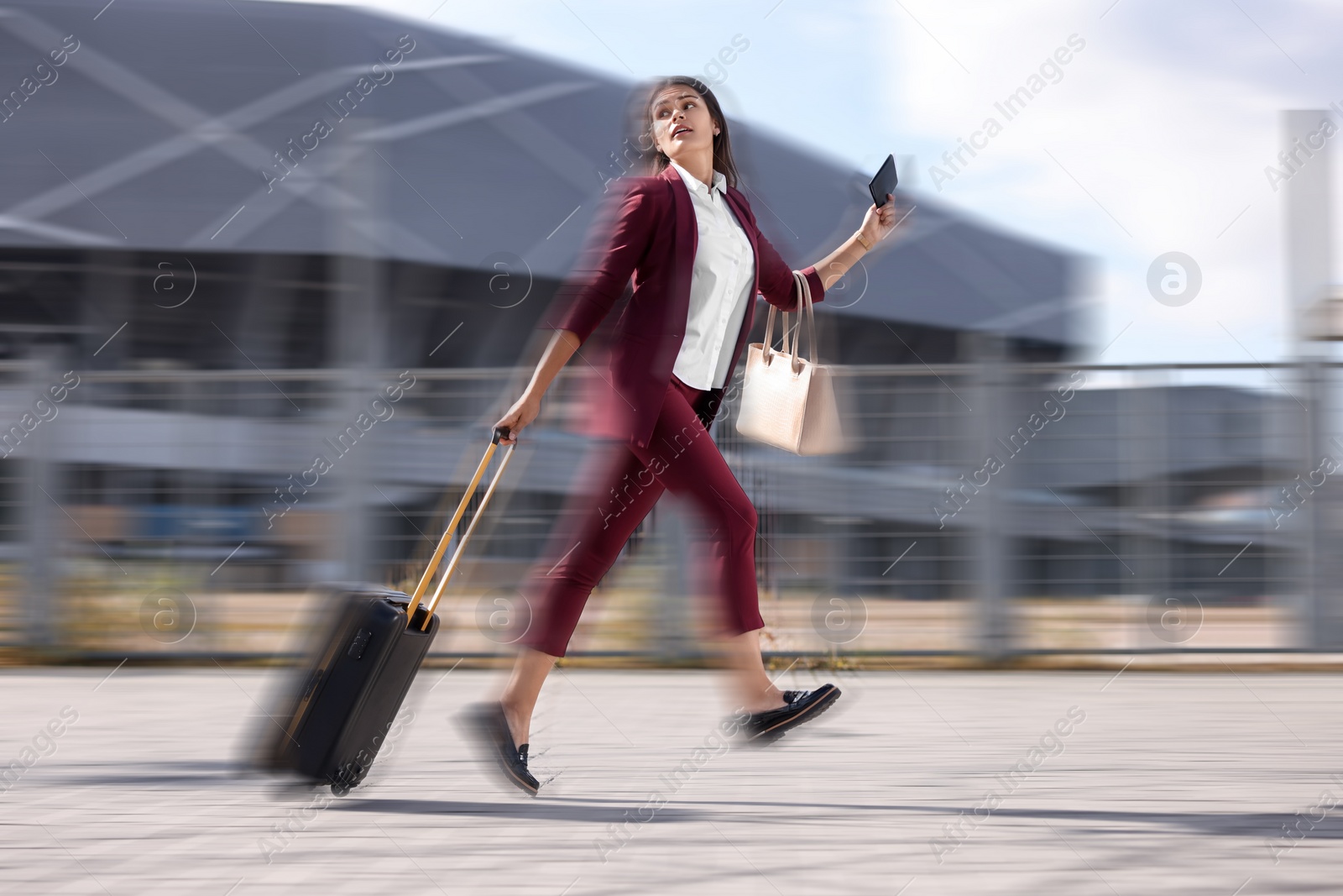 Image of Being late. Businesswoman with suitcase and ticket running at station. Motion blur effect