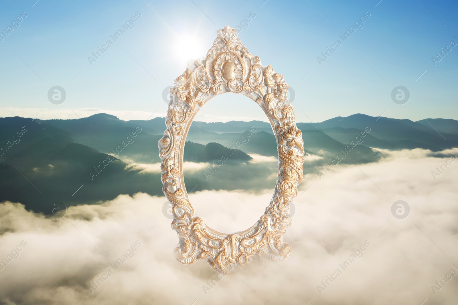 Image of Vintage frame and beautiful mountains covered with fog in morning