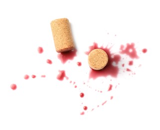 Photo of Bottle corks with wine stains on white background, top view