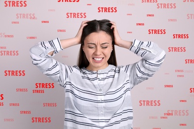 Image of Stressed young woman and text on light grey background