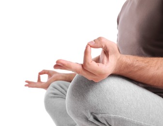 Photo of Man meditating on white background, closeup. Harmony and zen