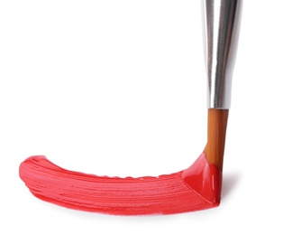 Photo of Brush with color paint and stroke on white background