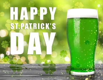 Image of Happy St. Patrick's Day. Tasty green beer on wooden table