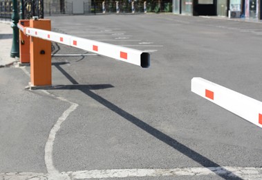 Photo of Closed boom barriers outdoors on sunny day