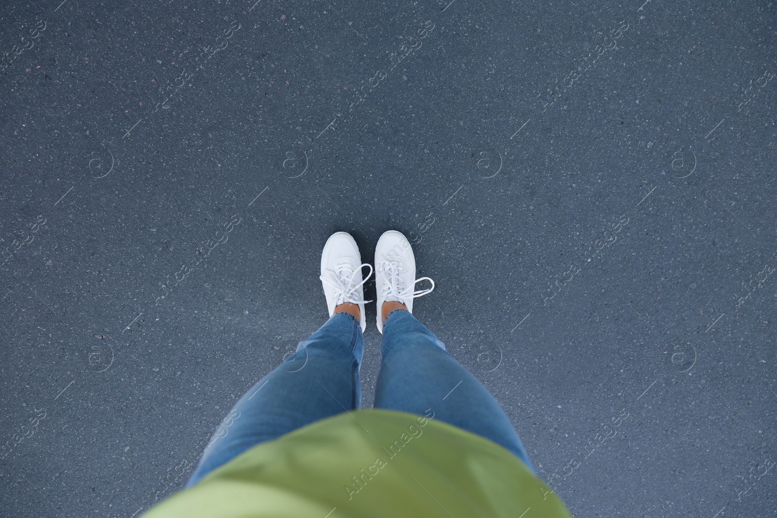 Photo of Woman standing outdoors, top view with space for text. Choosing way concept.