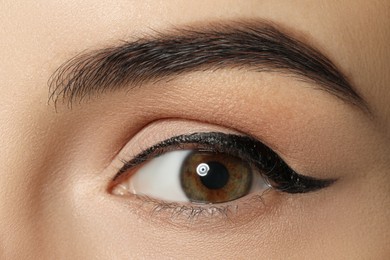 Young woman with beautiful eyebrows, closeup view