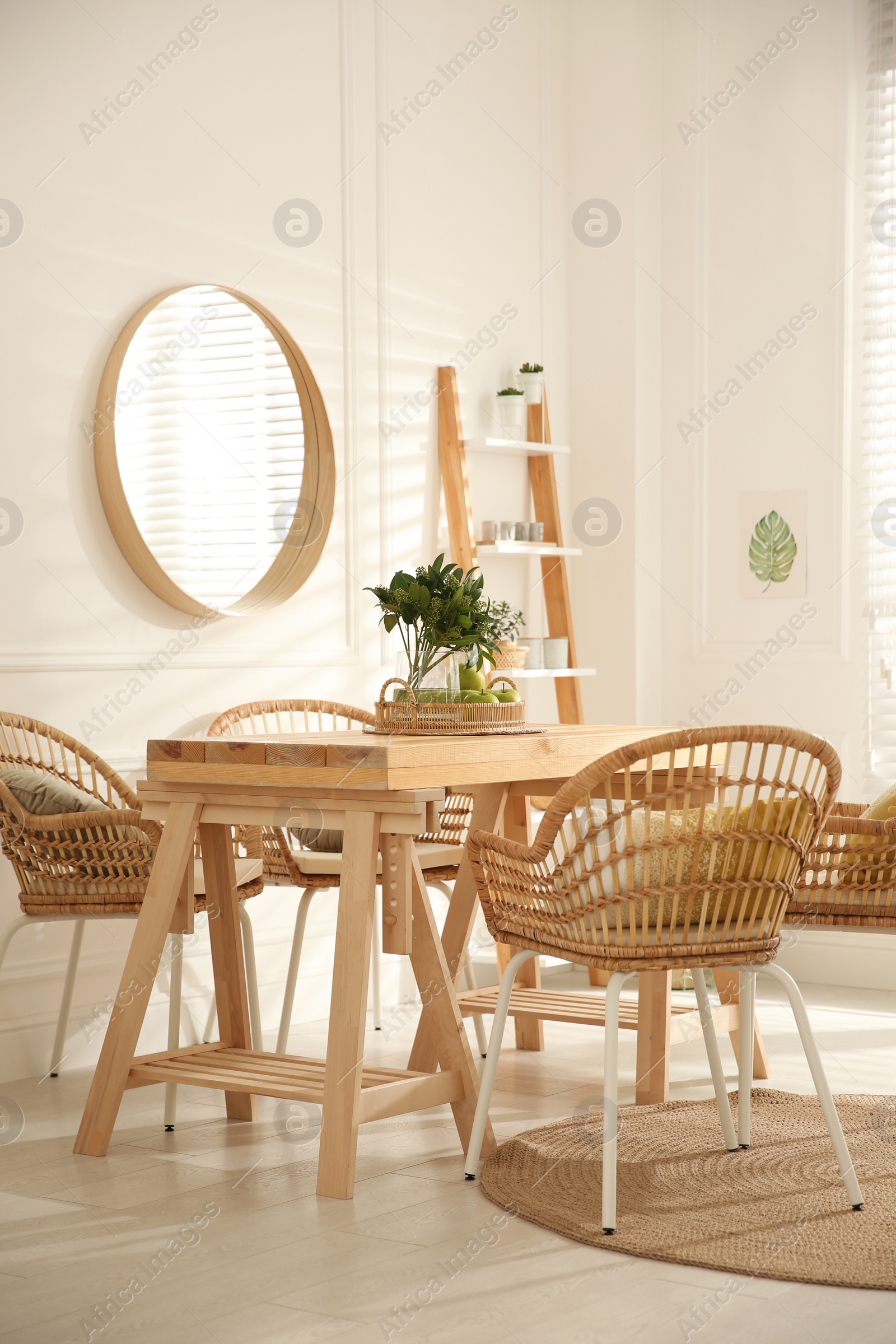 Photo of Stylish wooden dining table and chairs in room. Interior design