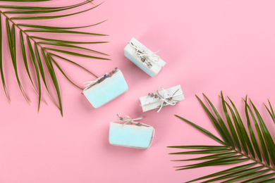 Flat lay composition with natural handmade soap on pink background