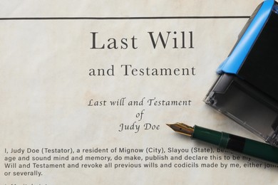 Photo of Last Will and Testament with fountain pen and stamp, top view