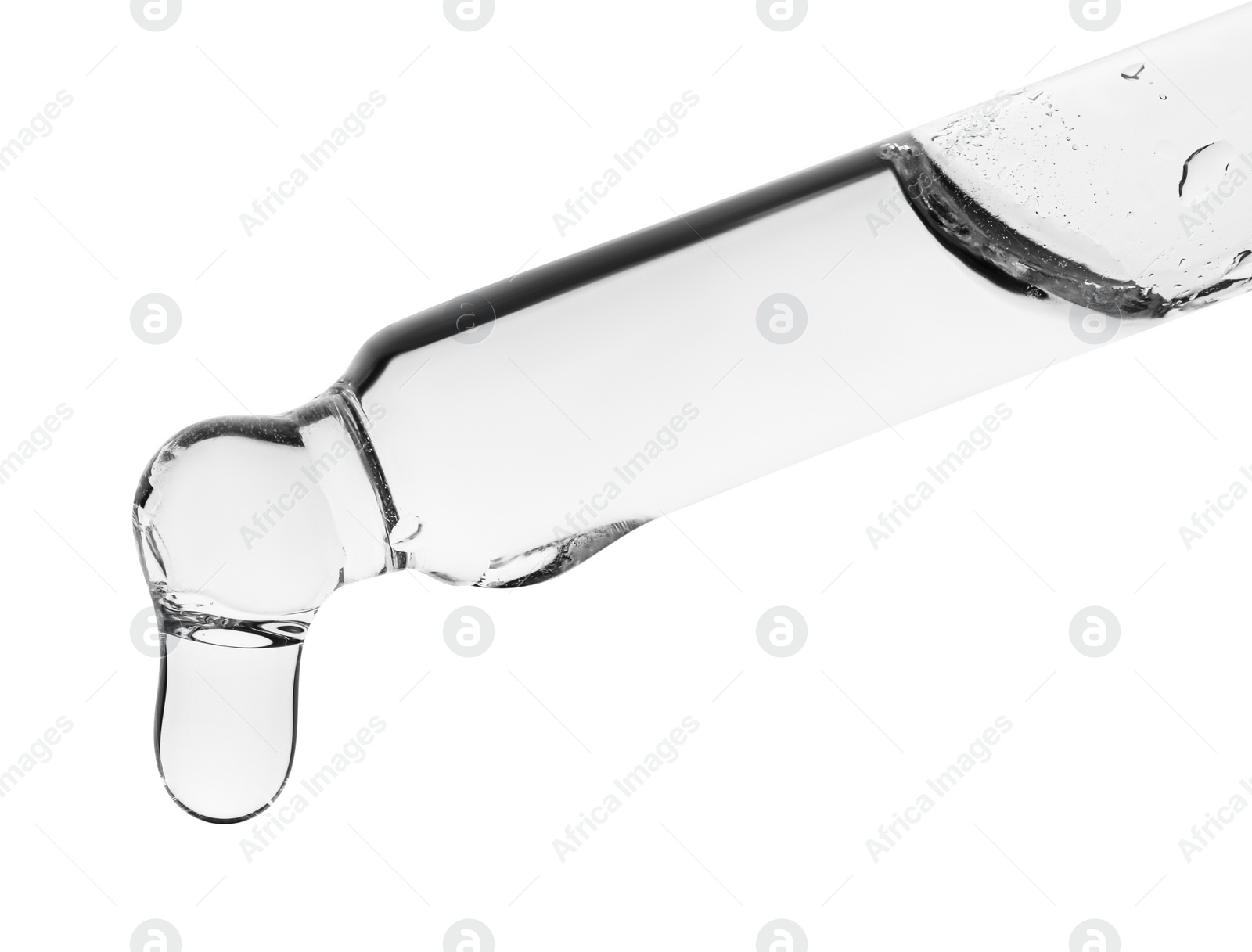 Photo of Dripping clear facial serum from pipette on white background, closeup