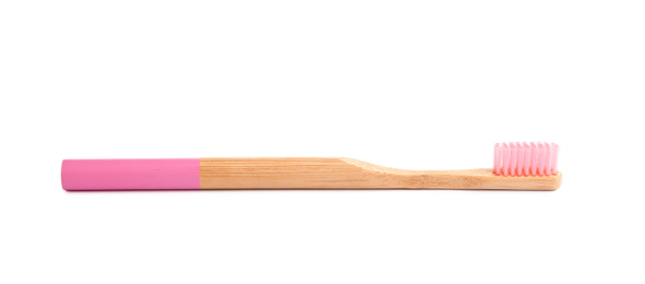 Bamboo toothbrush with pink bristle isolated on white