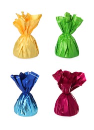 Image of Set with tasty candies in colorful wrappers on white background