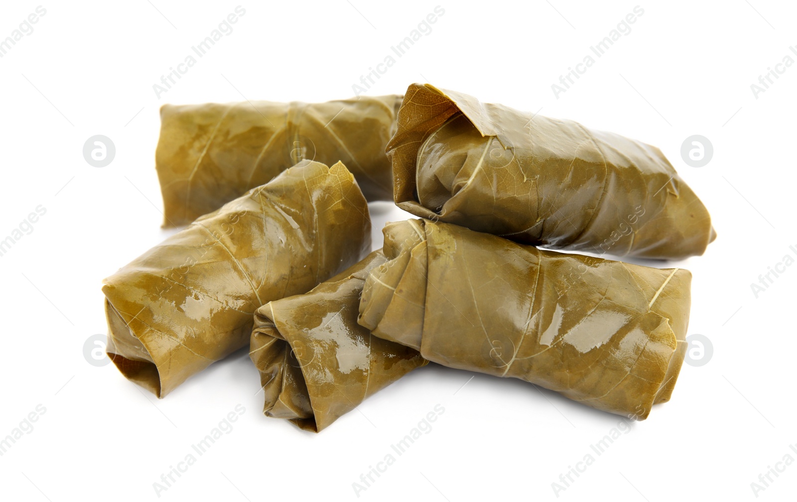 Photo of Delicious stuffed grape leaves on white background