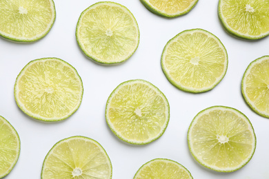 Fresh juicy lime slices on white background, top view