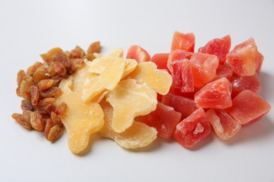 Photo of Pile of different dried fruits on white background
