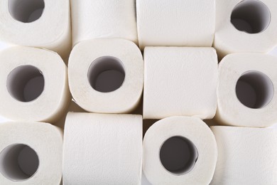 Photo of Many soft toilet paper rolls as background, above view