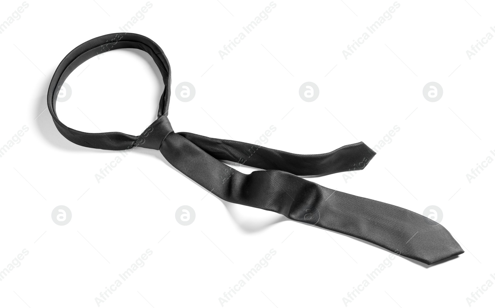 Photo of One black necktie isolated on white, above view