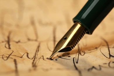 Photo of Writing letter with beautiful fountain pen, closeup