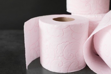 Soft toilet paper rolls on black background