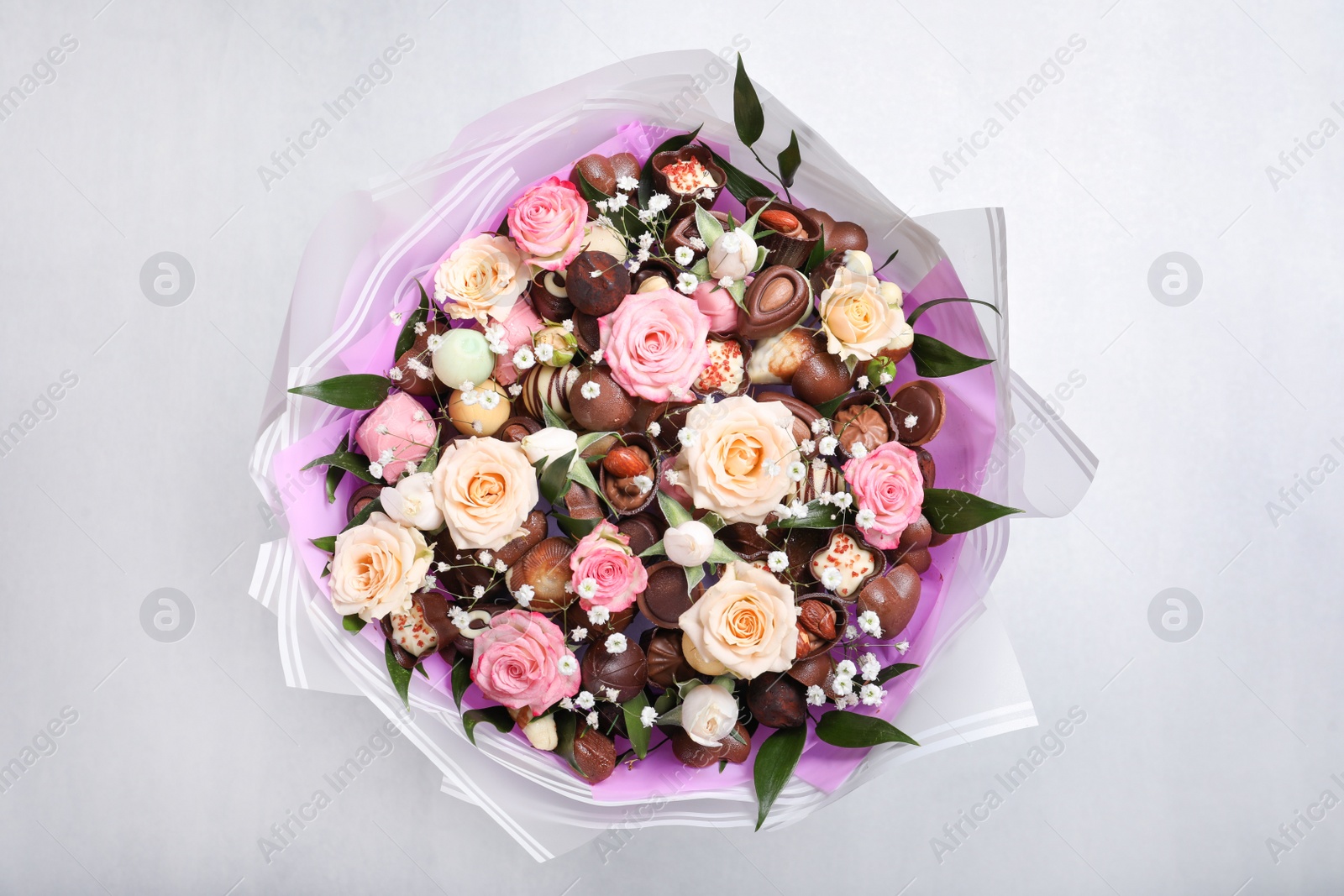 Photo of Beautiful food bouquet on light background, top view