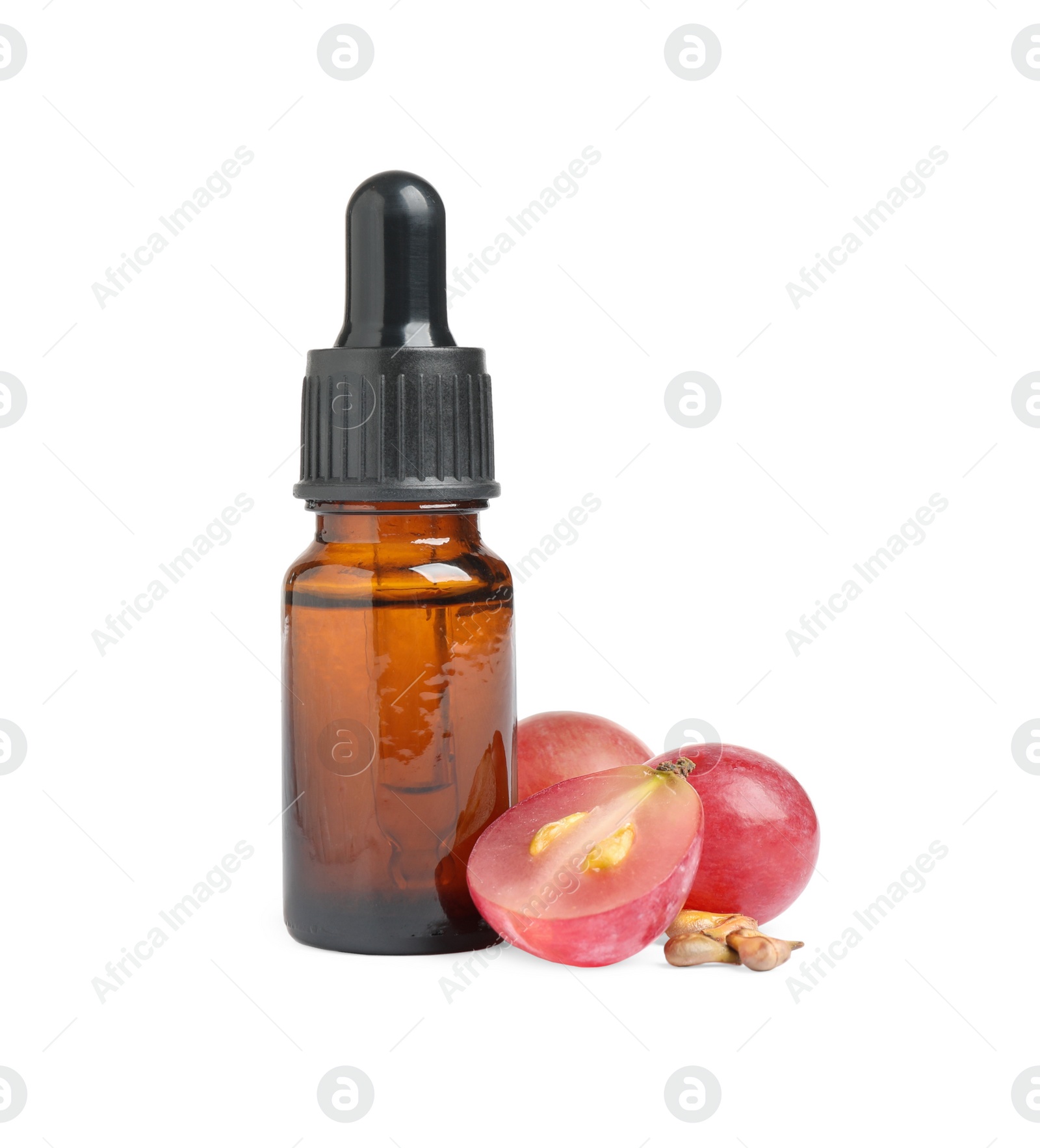Photo of Organic red grapes, seeds and bottle of natural essential oil on white background