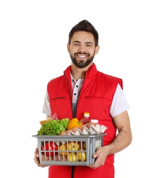 Photo of Man holding basket with fresh products on white background. Food delivery service