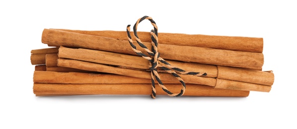 Photo of Aromatic dry cinnamon sticks on white background