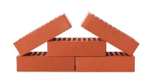 Photo of Many red bricks on white background. Building material