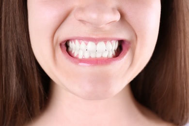 Photo of Young woman with beautiful smile, closeup view