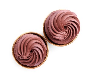 Photo of Delicious chocolate cupcakes isolated on white, top view