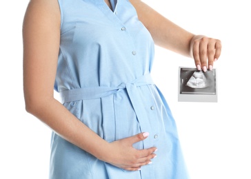 Photo of Pregnant woman with ultrasound picture on white background, closeup