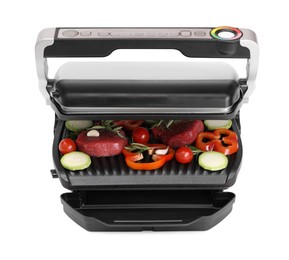 Photo of Electric grill with raw meat, rosemary and vegetables isolated on white