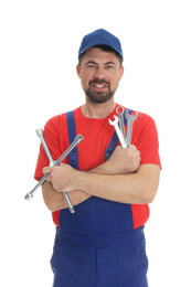 Photo of Portrait of professional auto mechanic with wrenches on white background