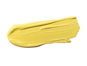 Photo of Stroke of yellow color correcting concealer isolated on white