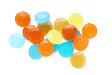 Photo of Many different color cough drops on white background, top view