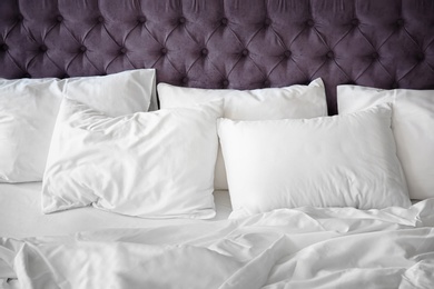 Photo of Comfortable bed with white linen at home