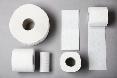 Photo of Flat lay composition with toilet paper on grey background