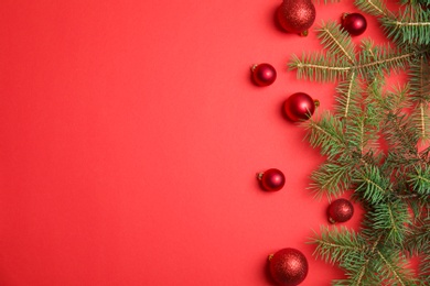 Photo of Flat lay composition with Christmas tree branches and festive decor on color background