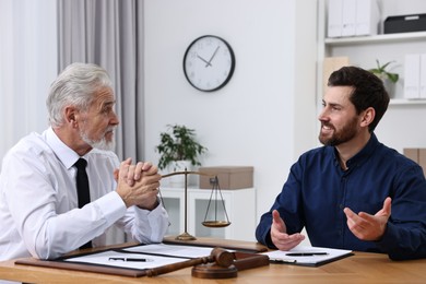 Man having meeting with lawyer in office